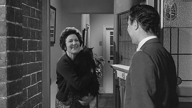 Ring of Spies - Gordon Lonsdale William Sylvester at door with Helen Nancy Nevinson holding longhair tabby cat