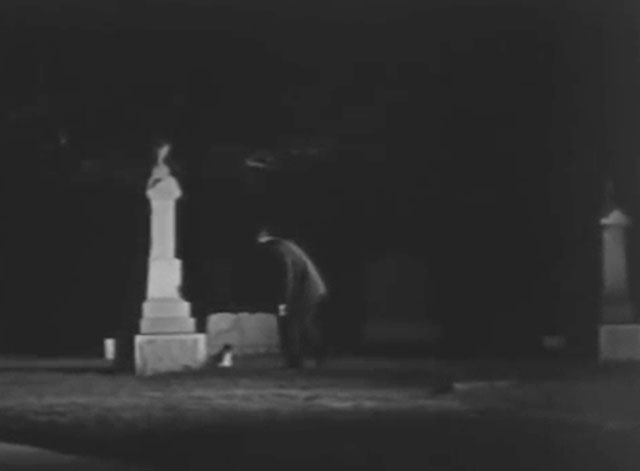 Ring of Terror - Dobson Joseph Conway approaching tuxedo cat Puma in graveyard