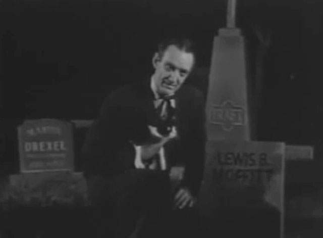 Ring of Terror - Dobson Joseph Conway holding tuxedo cat Puma by gravestone