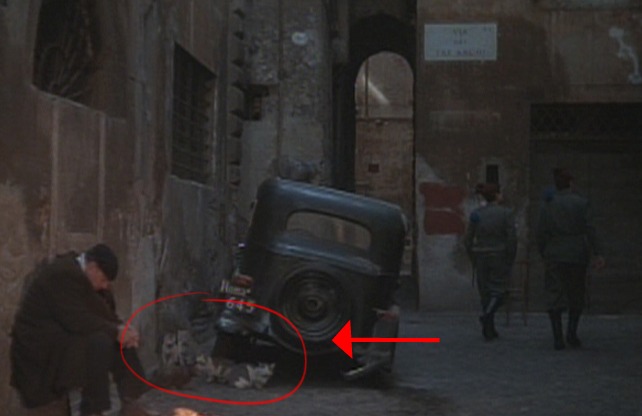 Roma - street cats by man and fire