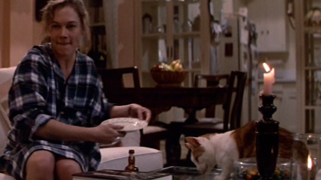 Romancing the Stone - Joan Wilder Kathleen Turner throwing plate with orange and white cat Romeo