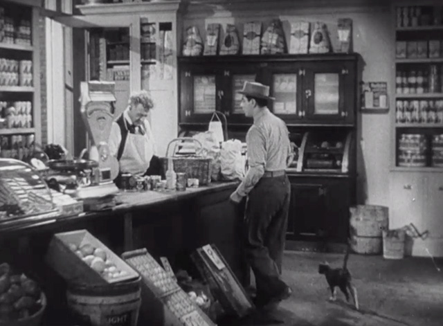 Roman Scandals - Eddie Cantor enters store with small cat following