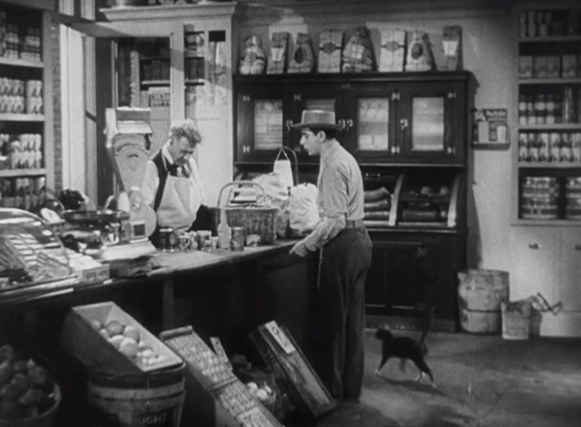 Roman Scandals - Eddie Cantor enters store with small cat following