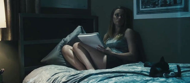 The Roommate - Rebecca Leighton Meester on bed with tuxedo kitten Cuddles