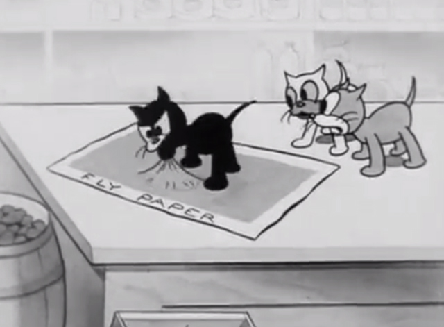 Rough on Rats - cartoon black kitten stuck on fly paper while two other kittens watch