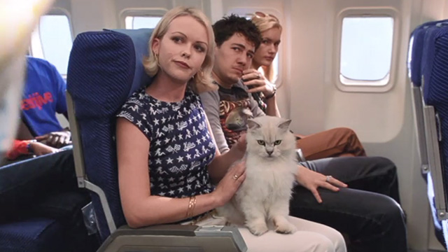 Scooby-Doo - white cat in woman's lap on plane