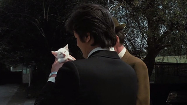 Scorpio - Laurier Alain Delon holding white kitten Sun Tzu