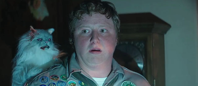 Scouts Guide to the Zombie Apolcalypse - Augie Joey Morgan with faux white Persian cat zombie on shoulder