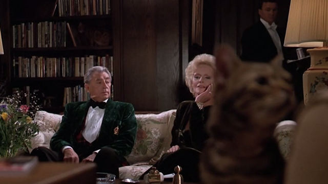 Scrooged - cat in foreground with Preston Rhinelander Robert Mitchum and Maria Riva