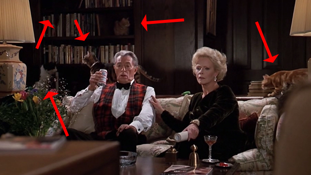 Scrooged - Preston Rhinelander Robert Mitchum and Maria Riva on couch with cats around them