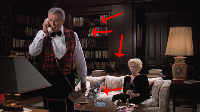 Scrooged - Preston Rhinelander Robert Mitchum and Maria Riva on couch with cats around them