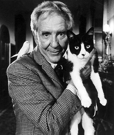 The Sentinel - black and white photo of Charles Chazen Burgess Meredith with tuxedo cat Jezebel and parakeet Mortimer