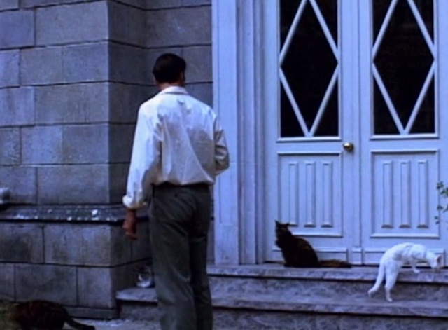 Serpent's Lair - group of cats outside door with Tom Jeff Fahey in daytime