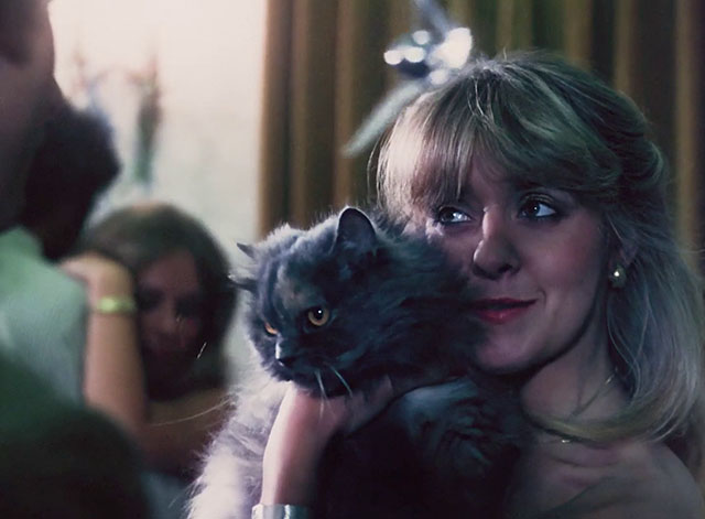 Sex with the Stars - Brenda Aquarias Terri Mitchell hugging longhair dilute tortoiseshell cat