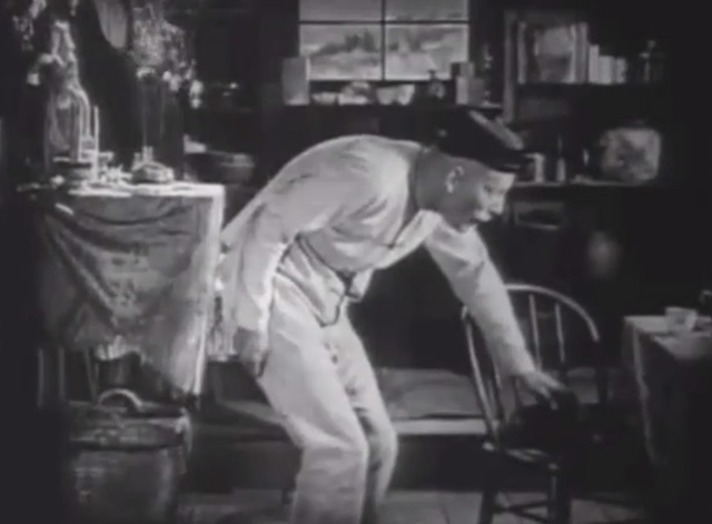 Shadows - Yen Sing Lon Chaney petting Bengal tabby cat on chair