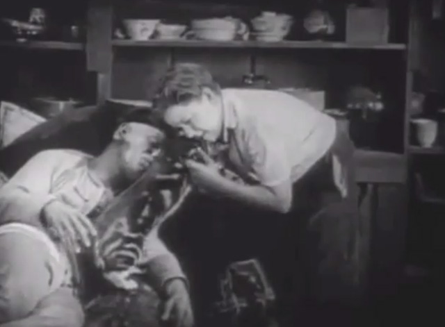 Shadows - Yen Sing Lon Chaney lying on death bed with boy Buddy Messenger lifting away Bengal tabby cat