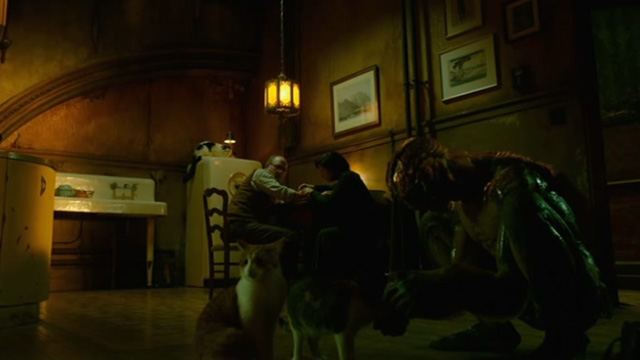 The Shape of Water - Amphibian Man playing with cats