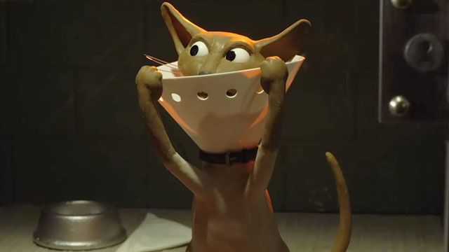 Shaun the Sheep Movie - Hannibal Lecter cat inside glass cell reaching up to pull down cone
