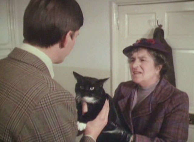 It Shouldn't Happen to a Vet - Mrs. Bond Marjorie Sudell handing tuxedo cat Seven Times Three to Carmody Paul Shelley