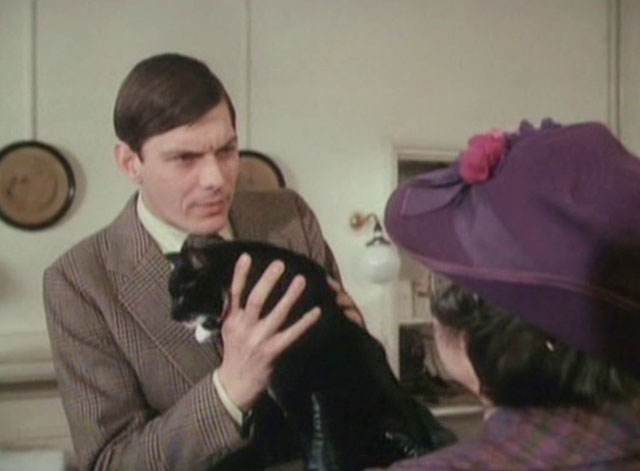It Shouldn't Happen to a Vet - Mrs. Bond Marjorie Sudell with tuxedo cat Seven Times Three held by Carmody Paul Shelley