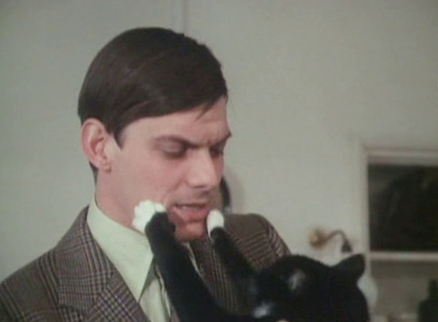 It Shouldn't Happen to a Vet - tuxedo cat Seven Times Three pawing at Carmody Paul Shelley face