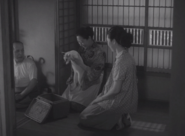 Shozo, a Cat and Two Women - Shinako Isuzu Yamada holding white and calico cat Lily
