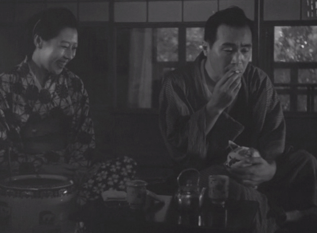 Shozo, a Cat and Two Women - Shinako Isuzu Yamada laughing with Shozo Hisaya Morishige holding white and calico cat Lily