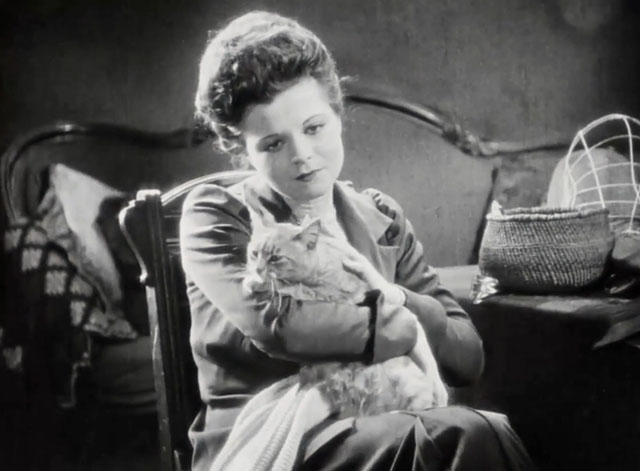 Silence - Norma Vera Reynolds cuddling tabby cat on lap