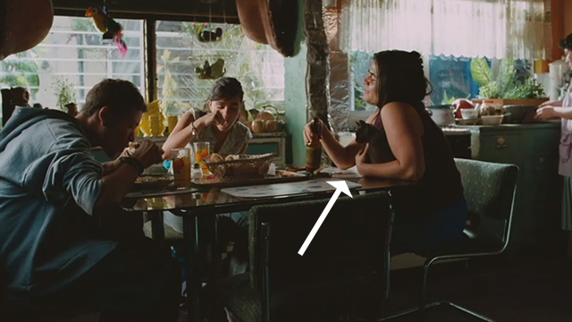 Sin Nombre - Willy Edgar Flores Sayra Paulina Gaitan and Aunt holding gray cat at table