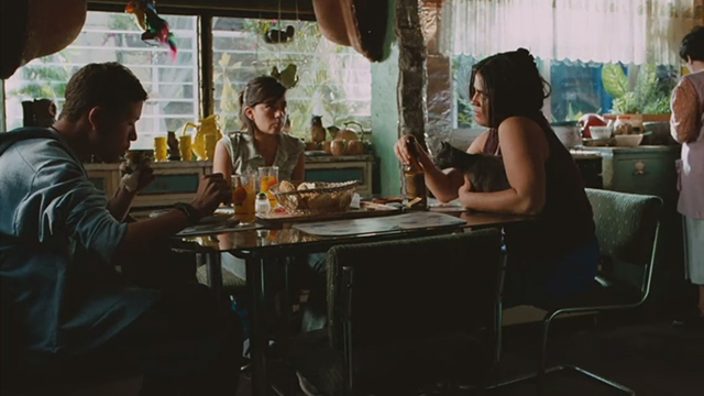 Sin Nombre - Willy Edgar Flores Sayra Paulina Gaitan and Aunt holding gray cat at table