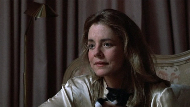 Six Degrees of Separation - Ouisa Stockard Channing in bed holding tuxedo kitten