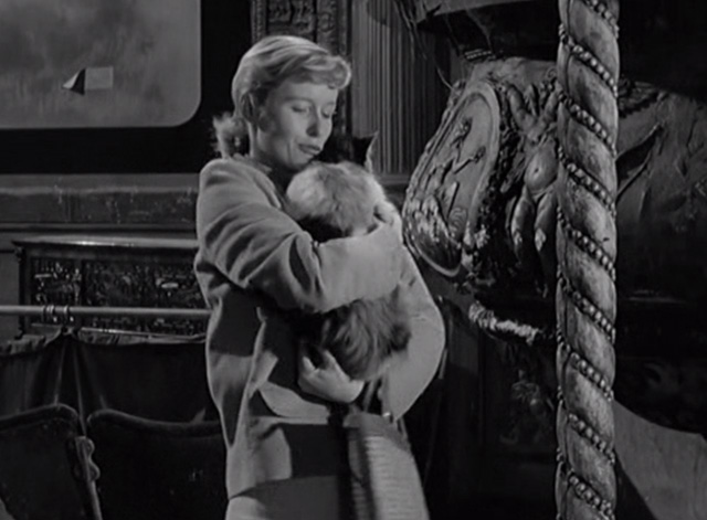 The Smallest Show on Earth - Jean Virginia McKenna holding long haired calico cat in movie theater