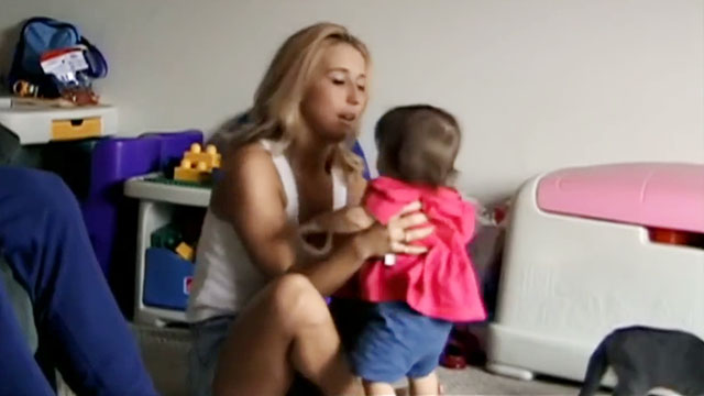 The Smashing Machine documentary - blue kitten tail beside Mark Coleman's wife and daughter