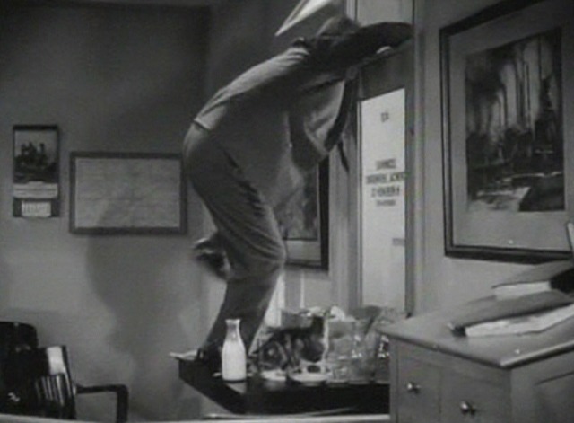 The Smiling Ghost - cat on desk drinking milk