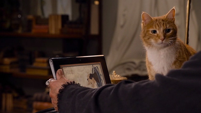 The Smurfs 2 - Azrael cat and Gargamel Hank Azaria looking at tablet