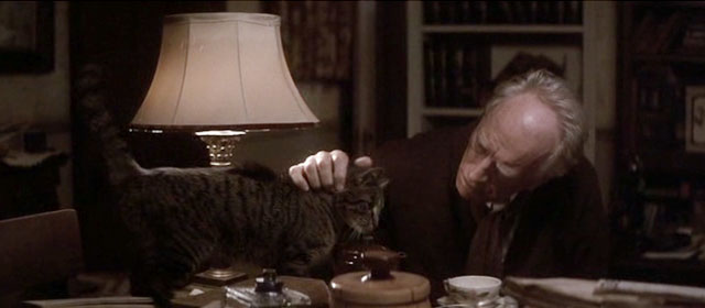 Snow Falling on Cedars - Nels Max von Sydow with brown tabby cat