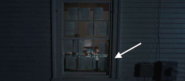 Sorry, Baby - gray tabby cat Olga Noochie inside window covered with papers