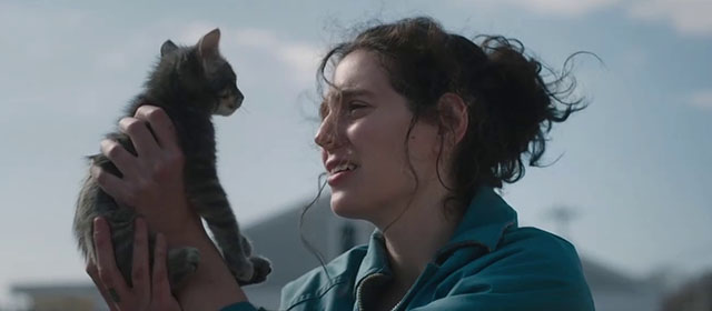 Sorry, Baby - Agnes Eva Victor holding up gray tabby kitten Olga Noochie