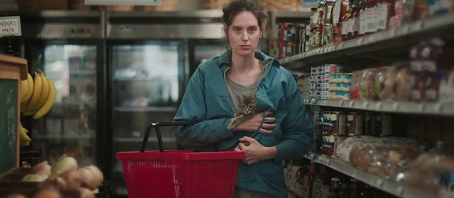 Sorry, Baby - Agnes Eva Victor holding gray tabby kitten Olga Noochie in jacket in grocery store