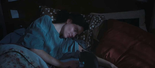 Sorry, Baby - Agnes Eva Victor lying in bed with gray tabby kitten Olga Noochie