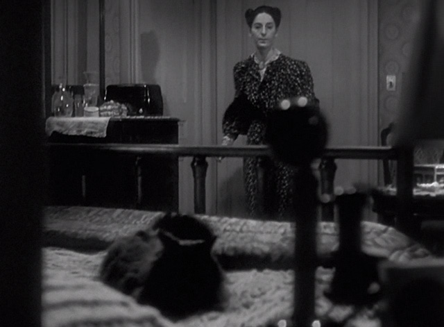 Sorry, Wrong Number - black cat sitting on bed as Ms. Jennings Dorothy Neumann enters