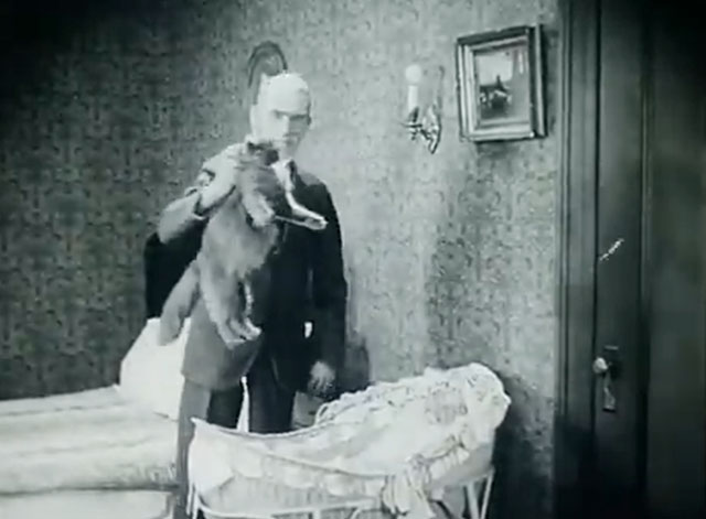 The Soul of Youth - Mr. Hodge Fred Huntley picking up longhair gray cat Babe by scruff