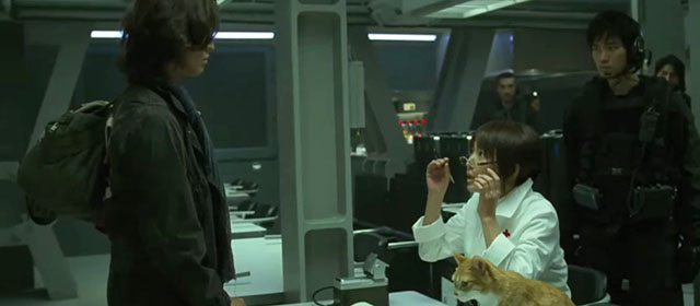 Space Battleship Yamato - Dr. Sado Reiko Takashima looking up at Kodai Takuya Kimura with ginger and white tabby cat on table