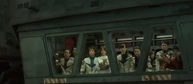 Space Battleship Yamato - Dr. Sado Reiko Takashima holding ginger and white tabby cat with surviving crew members on escape craft