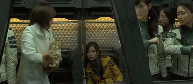 Space Battleship Yamato - Dr. Sado Reiko Takashima holding ginger and white tabby cat while turning to Yuki Meisa Kuroki