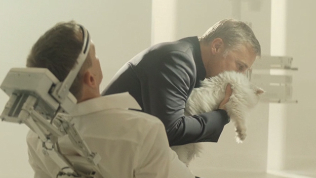Spectre - Blofeld Christoph Waltz hugging white Angora cat