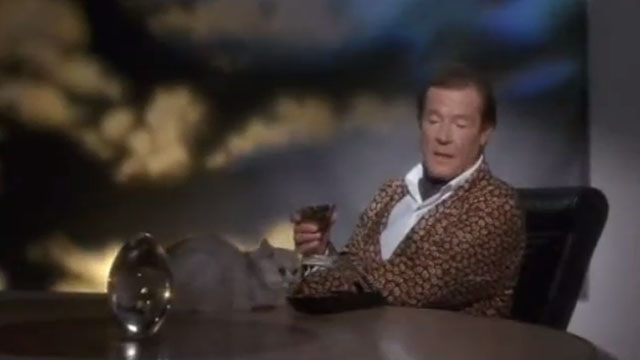Spice World - white longhair cat sitting with The Chief Roger Moore