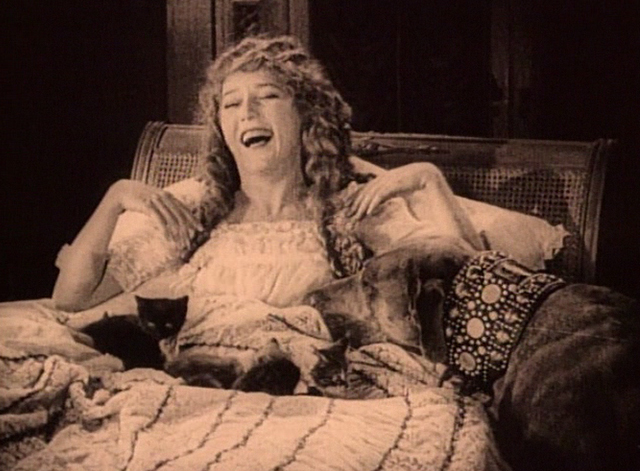 Stella Maris - Mary Pickford laughing with kittens on bed and Teddy dog