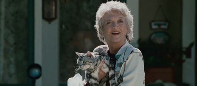 The Stepfather - Mrs. Cutter Nancy Linehan Charles holding British shorthair cat outside