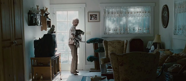 The Stepfather - Mrs. Cutter Nancy Linehan Charles holding British shorthair cat by front door